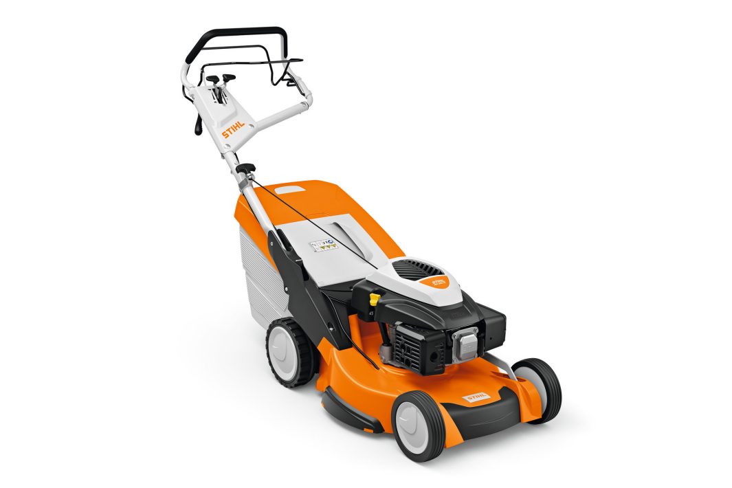 The Stihl RM 655.1 VS Lawn Mower in orange, white, and black has sturdy wheels, a rear grass bag, and an easy-manoeuvre handle.