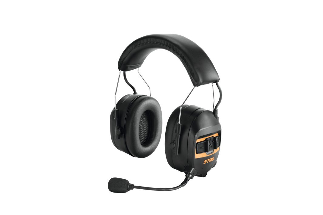 The Stihl ADVANCE PROCOM Ear Defenders are black with a cushioned headband, mic, orange logo, and control buttons for communication.