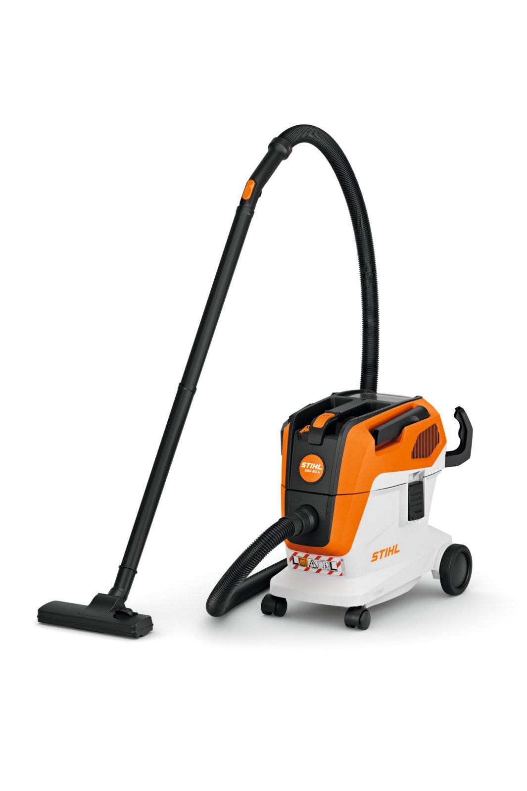 The Stihl SEA 60.0 (AK) Vacuum has an orange and white body, black hose, flat floor nozzle, and wheels on a white background.