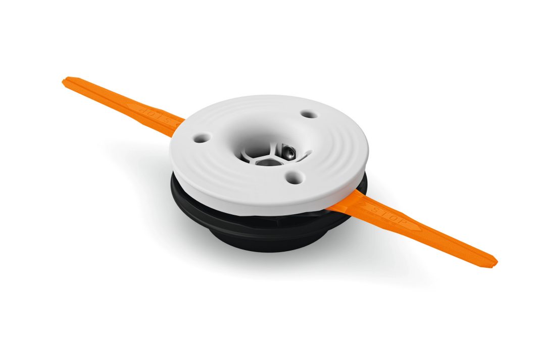 The Stihl PolyCut 28-2 trimmer head features a white and black circular body with two orange lines extending outwards.