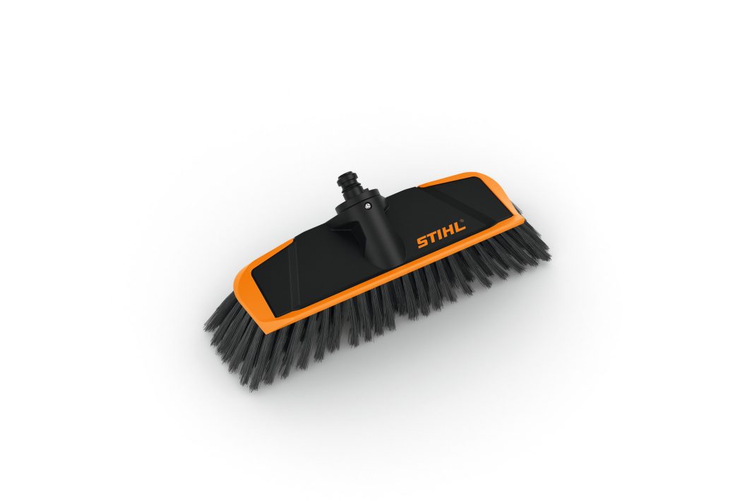 The Stihl Washing brush is an angled black and orange broom head with dense black bristles, ideal for washing, on a white background.