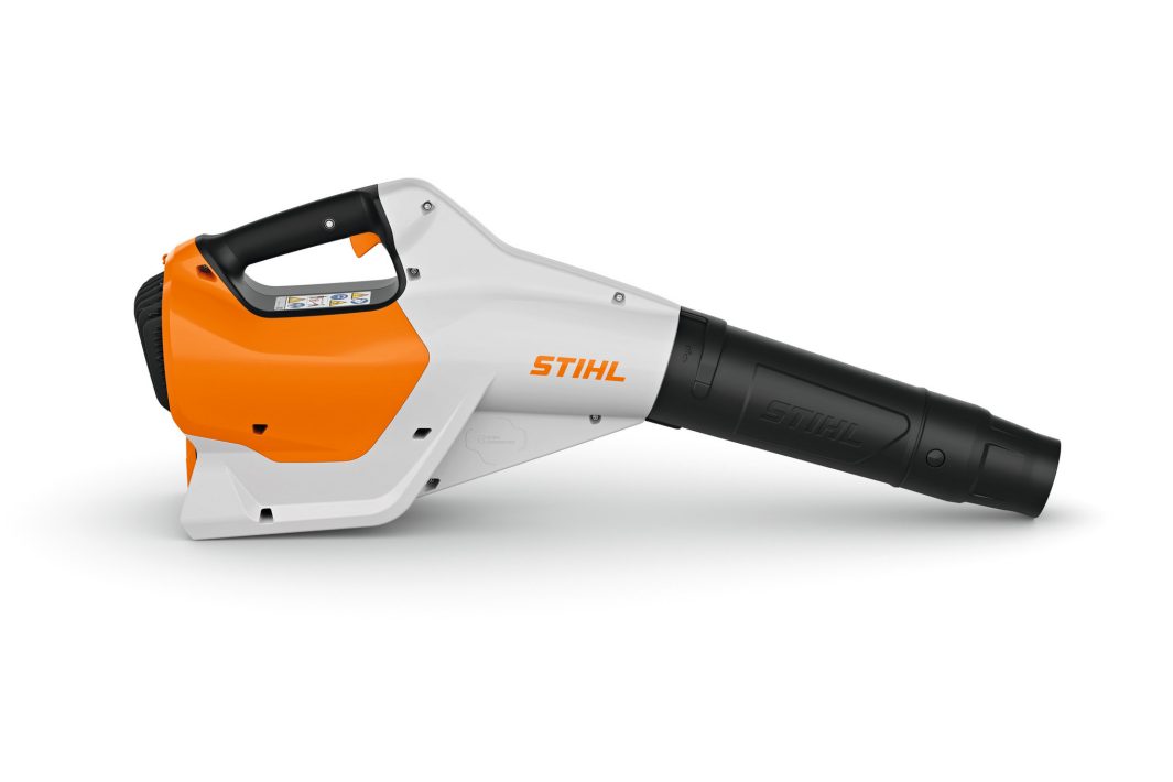 A Stihl cordless leaf blower featuring an orange and white body, black handle, and black nozzle, placed against a white background.