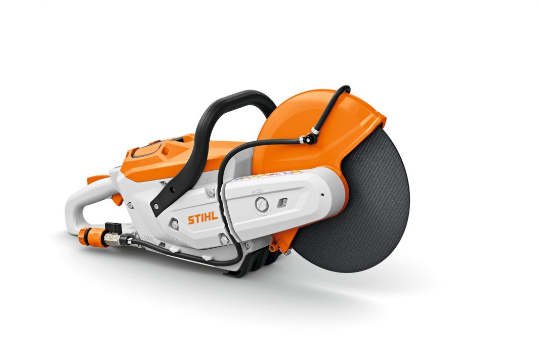 A STIHL concrete cut-off saw with an orange and white body, black circular blade, and handle, shown on a white background.