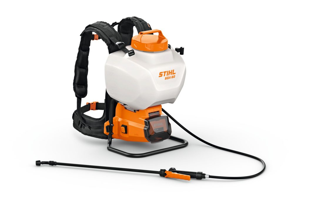 A rucksack sprayer with black straps, a white tank, orange base, and a black hose connected to a spray lance for spraying tasks.