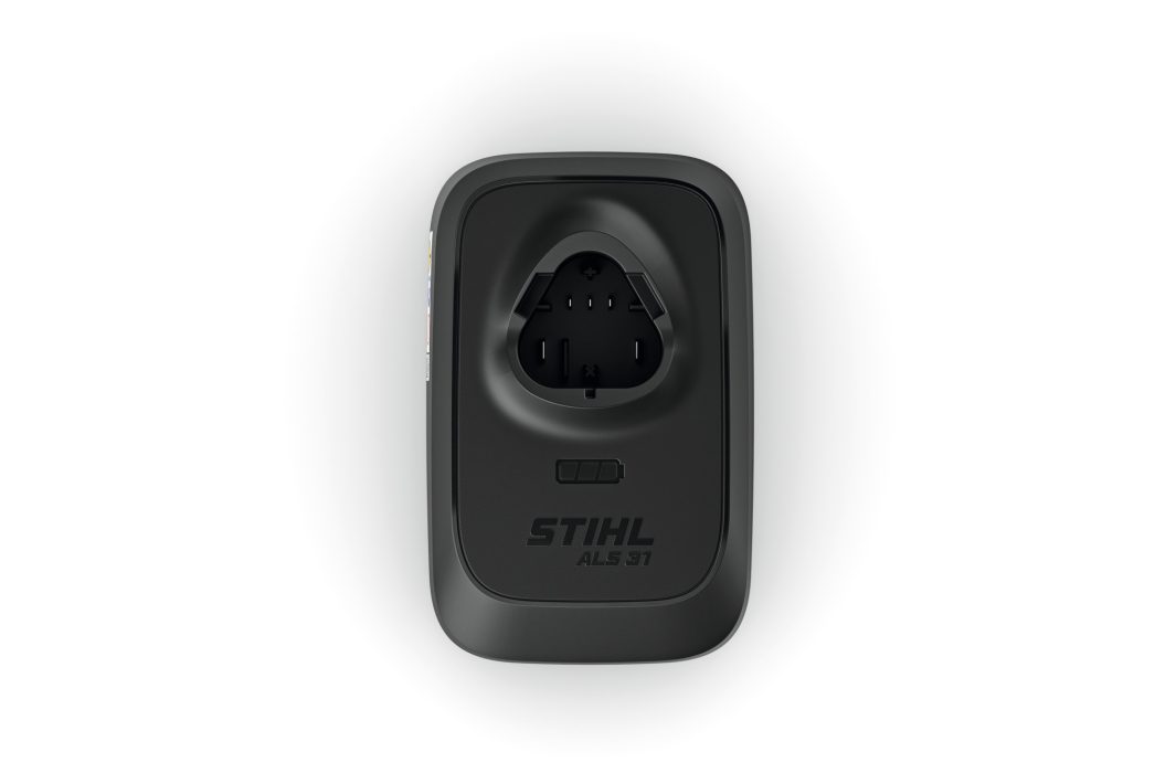 Black STIHL AL 301 battery charger seen from above, displaying the charging slot and logo on a plain white background.