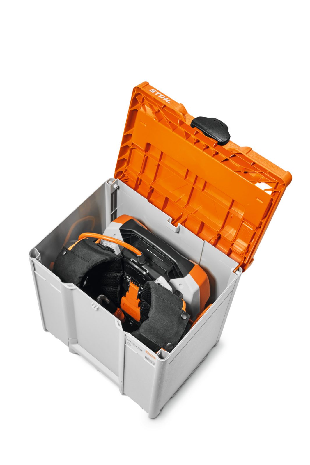 A grey and orange plastic storage box with an open lid, holding a circular saw secured inside with protective foam padding.