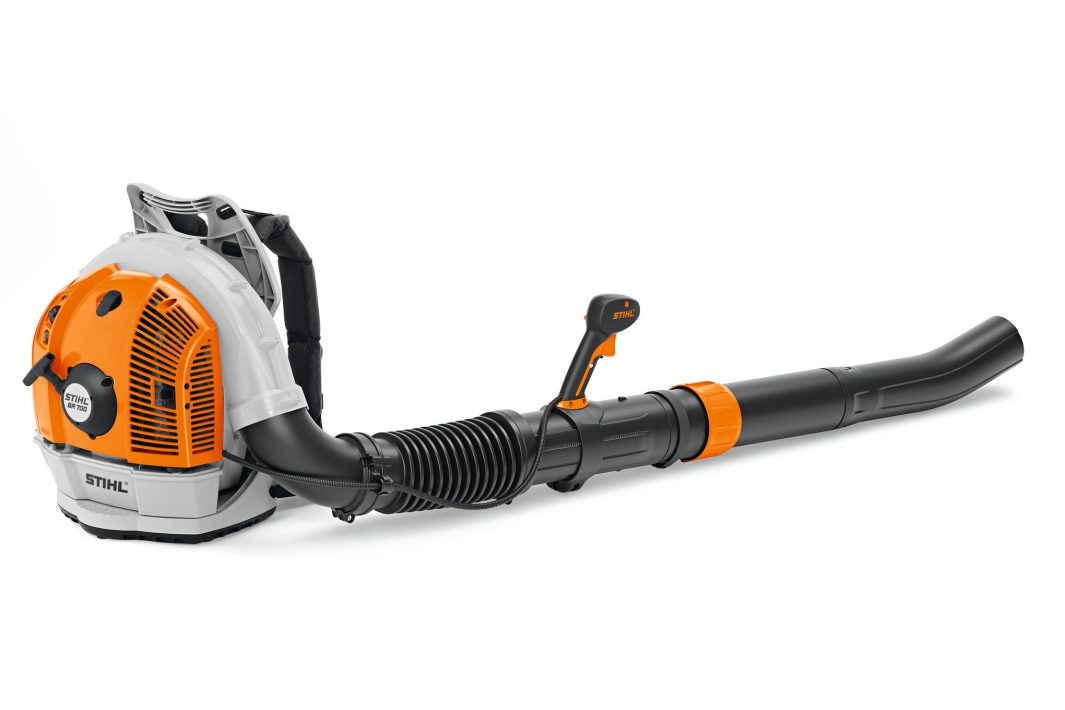 The Stihl BR 700 Backpack Blower has an orange and white engine, black air tube, and control handle for efficient garden work.