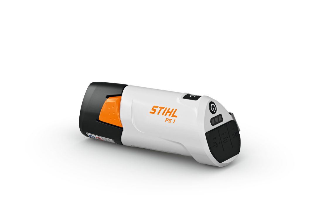A compact Stihl PS1.0 (AS) Power Station & Charger in white, black, and orange with buttons and logo, on a white background.