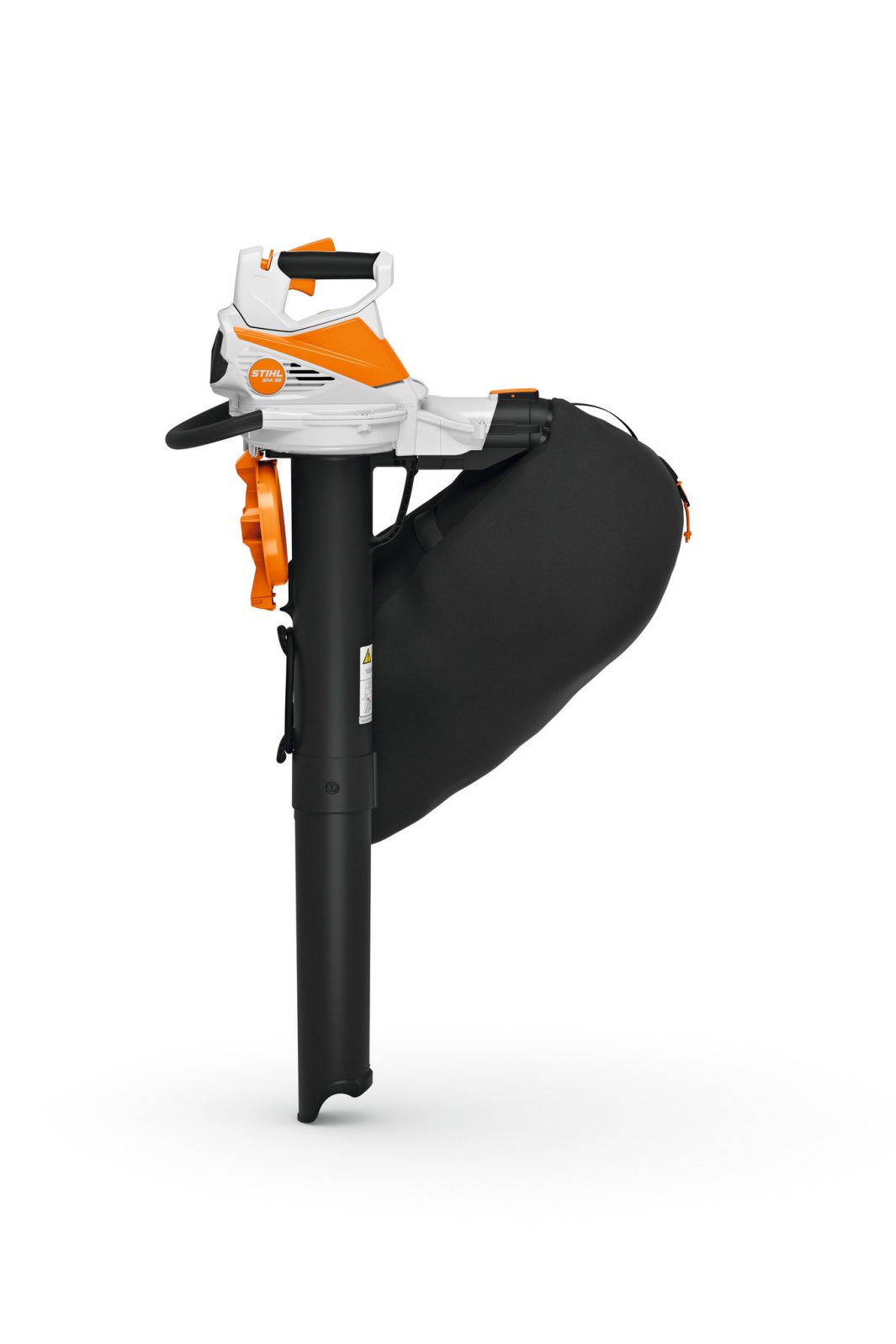 A Stihl SHA 56 Blower/Vac KIT with orange and white body, black handle, and large black bag stands upright on a white background.
