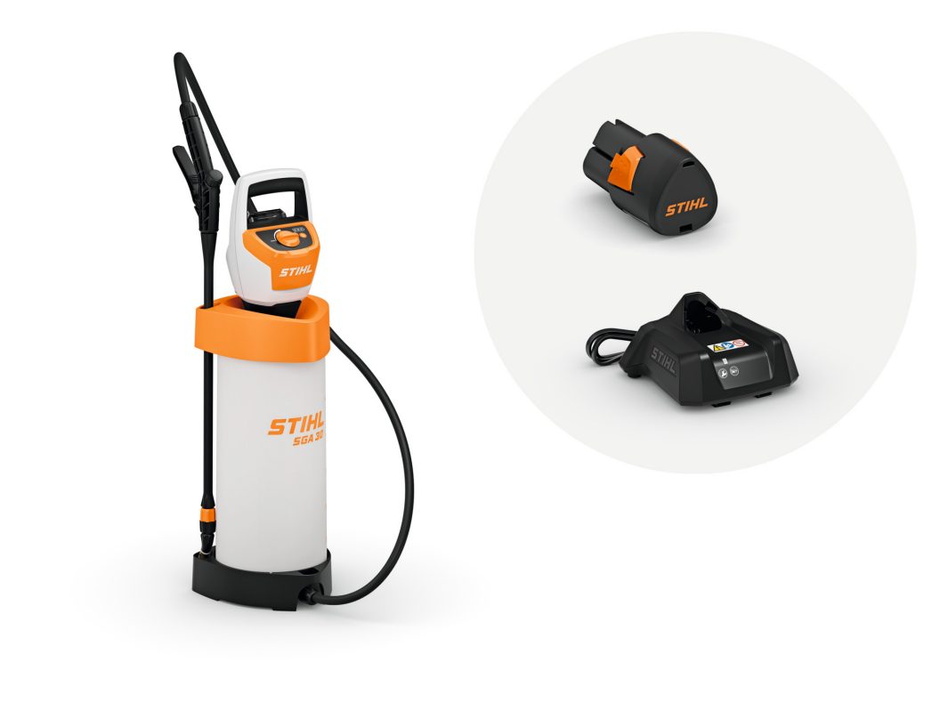 The Stihl SGA 30.0 SET Sprayer, white and orange, with black AS2 battery, AL1 charger, hose, and handle on a white background.