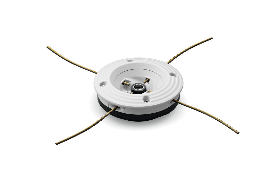 A round white plastic component with four metal pins inside and four yellow wires extending outward in a cross shape on white.