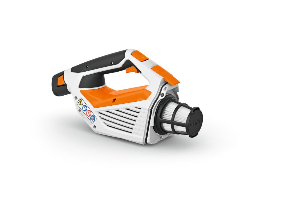 A white and orange handheld battery-powered tool with a black handle, ventilation slats, and a cylindrical nozzle on a white background.