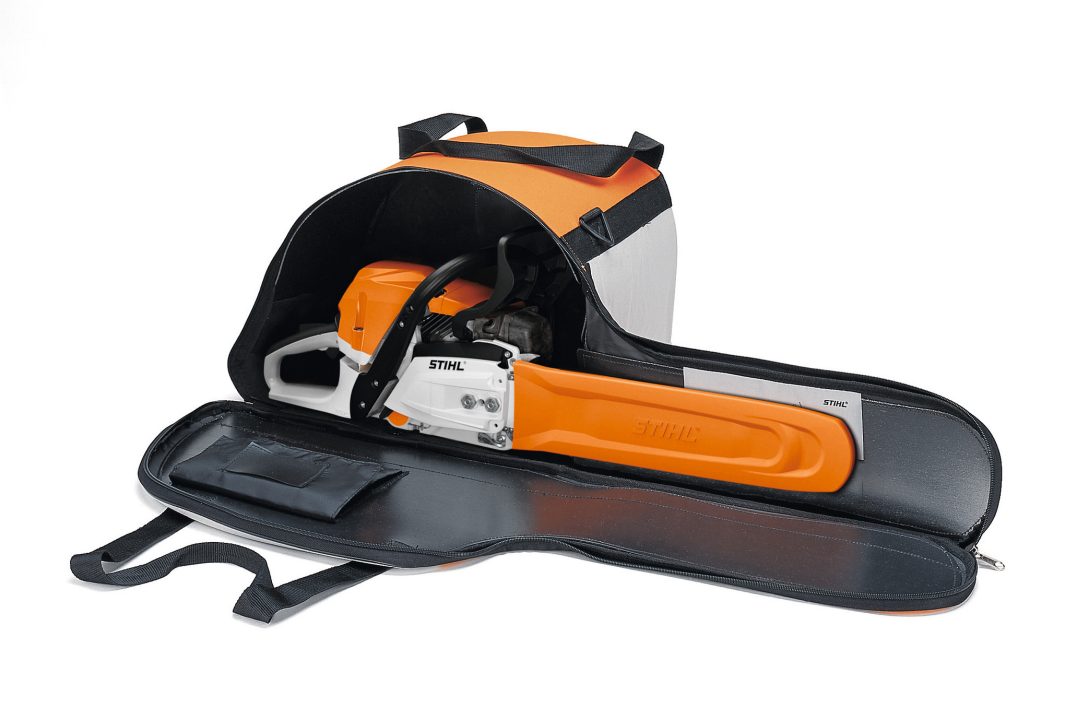The orange and black Stihl Chainsaw Carry/Storage Bag is partially unzipped, showing a chainsaw inside with handles for easy transport.